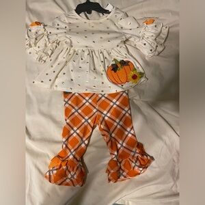 Gently used baby girl pumpkin outfit.
